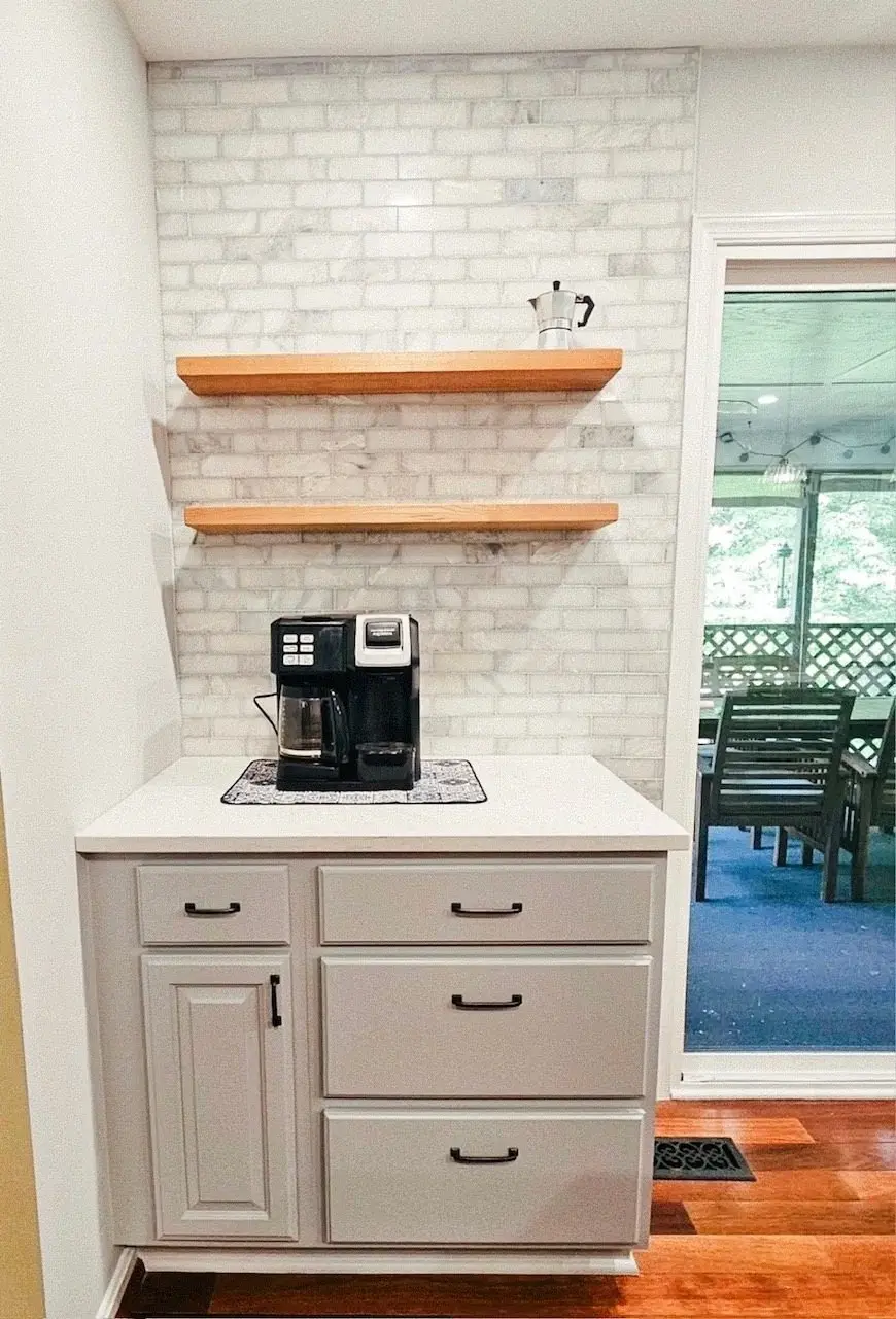 Finished painted cabinetry with coordinated wood floors and kitchen details
