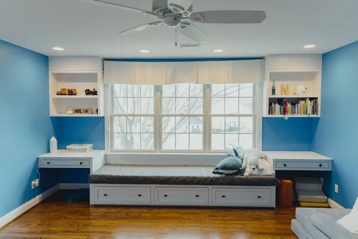 Finished window-seat built-ins with integrated shelving and storage