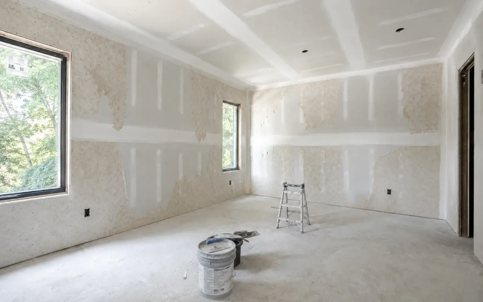Existing wall in a before-state with outdated wallpaper ready for update
