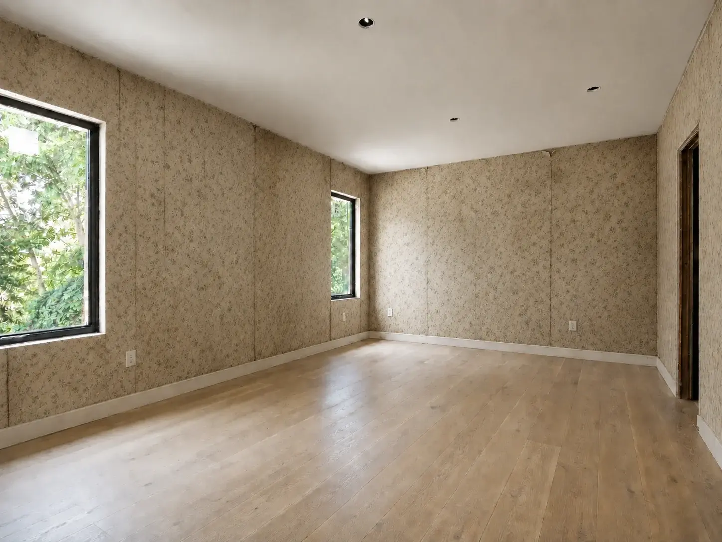 Existing wall in a before-state with outdated wallpaper ready for update