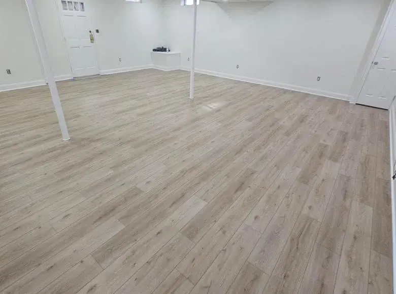 Finished lower-level room planned for comfort, circulation, and everyday use
