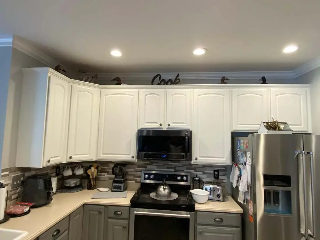 Finished kitchen with a large island, light cabinetry, and open circulation