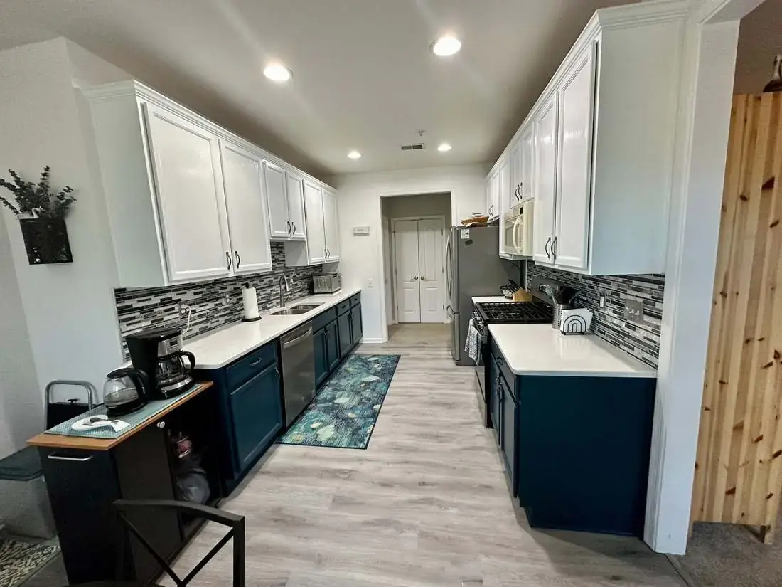 Painted blue and white kitchen cabinetry
